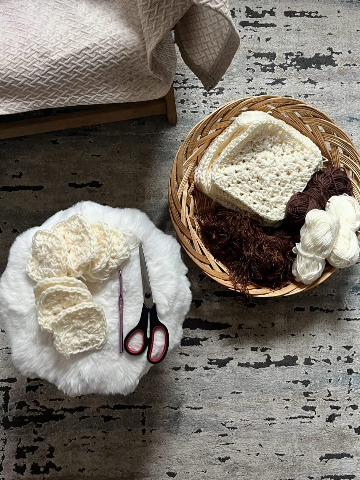 Crochet tools and handmade squares at the VELONA making table